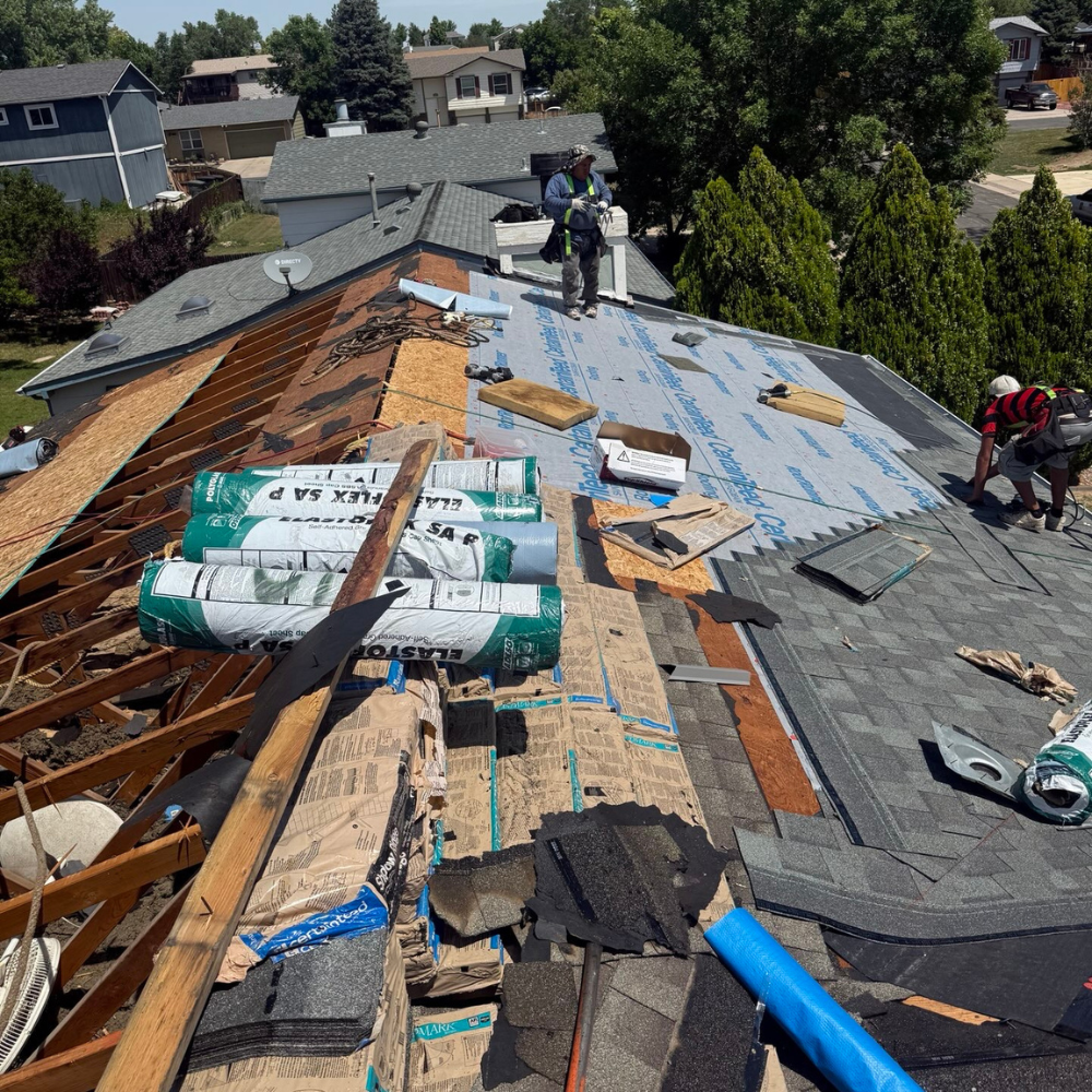 Roof Warranty vs Insurance: roof replacement in progress with decking exposed