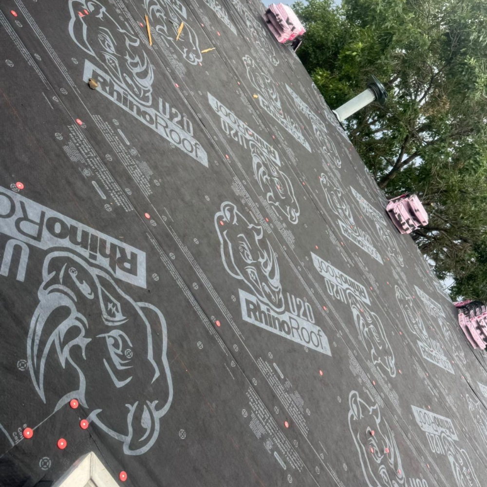 RhinoRoof underlayment installed across the entire roof deck, providing a water-resistant barrier before shingle installation.