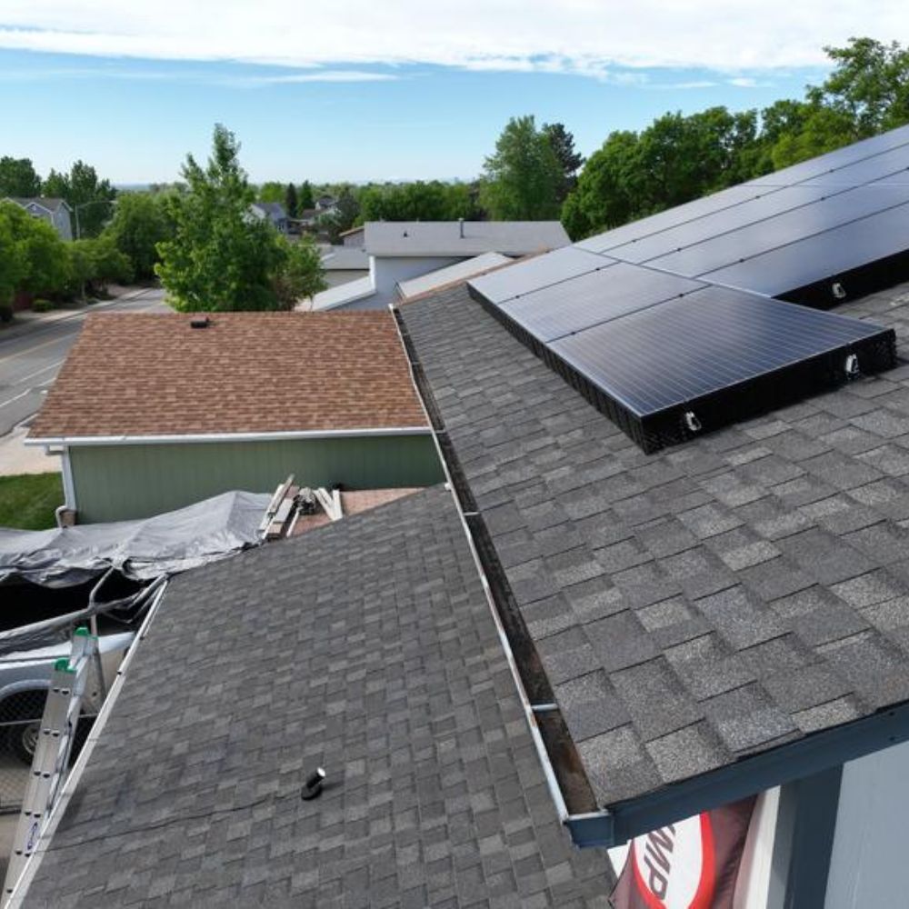 solar panels installed on asphalt shingle roof after roofing and solar integration