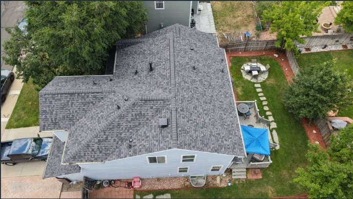 new roof, south slope with vent stack visible